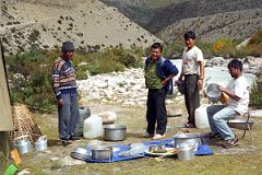 04 Our Crew Cleaning Our Dinner Dishes At Kharta Tibet.jpg